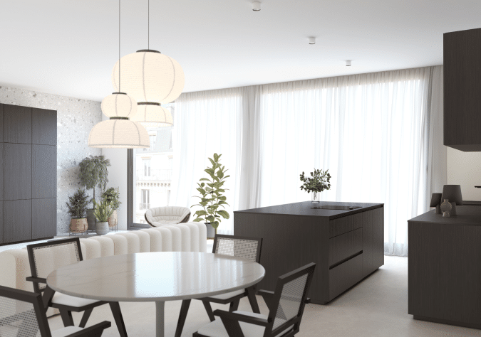 Un îlot noir à côté d'une table ronde et 4 chaises