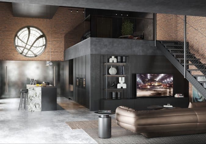 Cuisine et salon noir avec un canapé brillant dans un loft