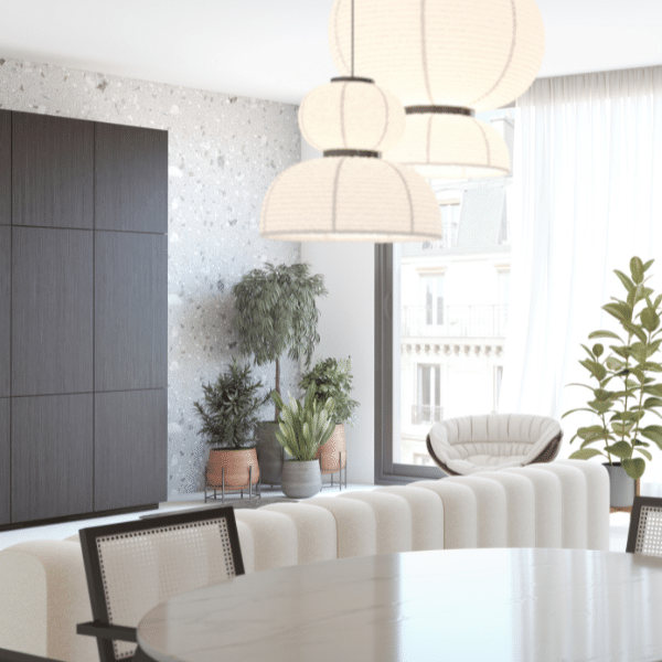 Vue sur le salon avec un canapé et une table blanche