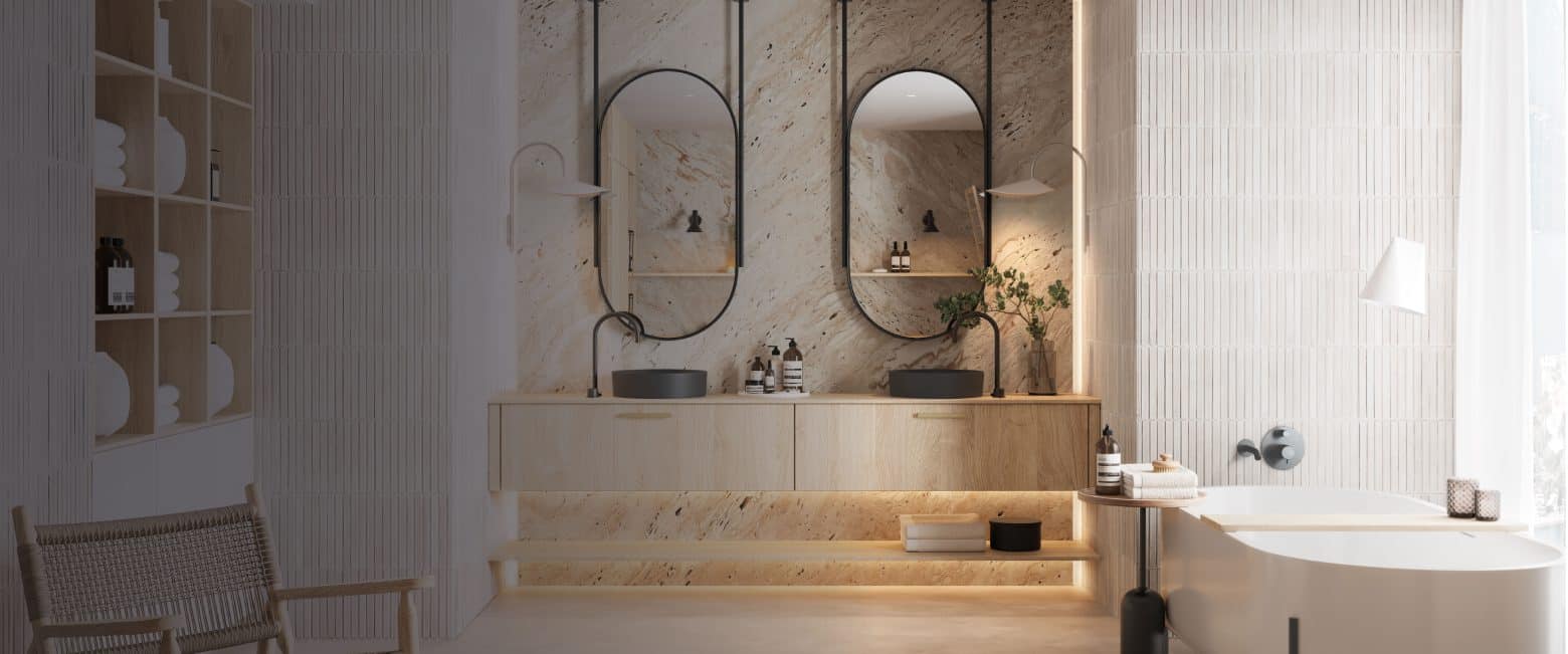 Une salle de bain avec des miroirs arrondis suspendus au-dessus d'une double vasque